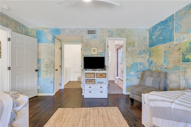 bedroom featuring baseboards, dark wood-style flooring, visible vents, and wallpapered walls