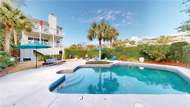 view of swimming pool featuring a fenced in pool, a patio area, and stairs