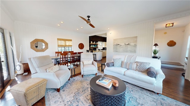 living room featuring ceiling fan, recessed lighting, wood finished floors, and crown molding