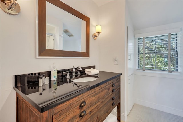 bathroom featuring vanity and baseboards