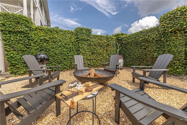 view of patio / terrace featuring a fire pit