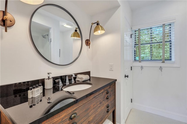 bathroom with vanity and baseboards