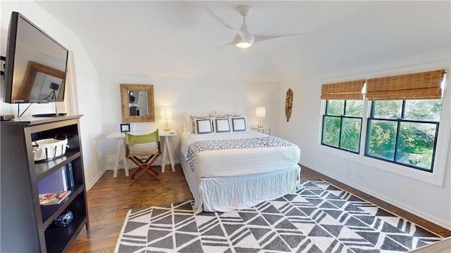 bedroom featuring dark wood-style floors, ceiling fan, and baseboards