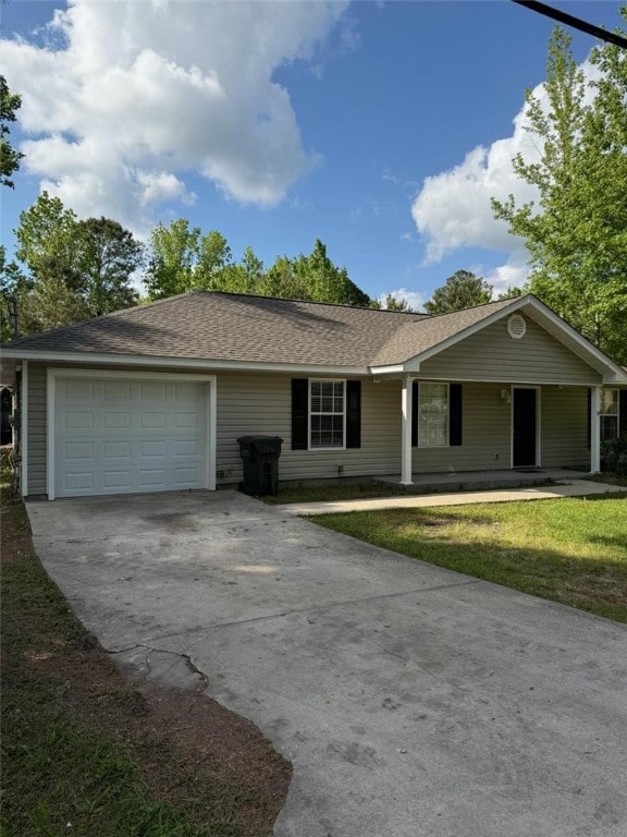 155 May Rd, Brunswick, GA 31525 - ranch-style house with a garage, a shingled roof, and concrete driveway