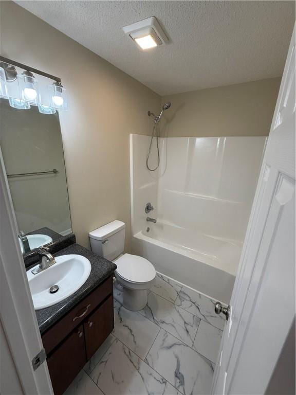 full bathroom with vanity, a textured ceiling, bathing tub / shower combination, and toilet