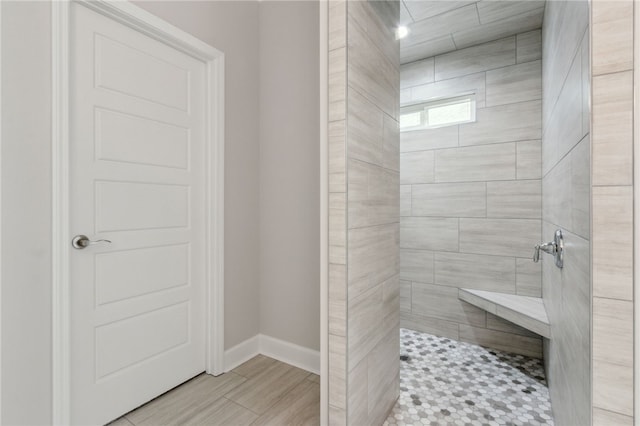 bathroom featuring a tile shower