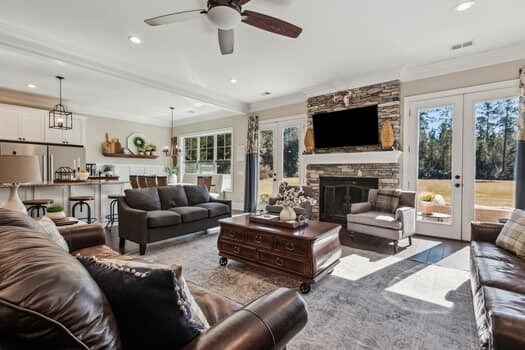 living area with a fireplace, recessed lighting, french doors, and ceiling fan