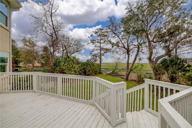 wooden terrace with a yard