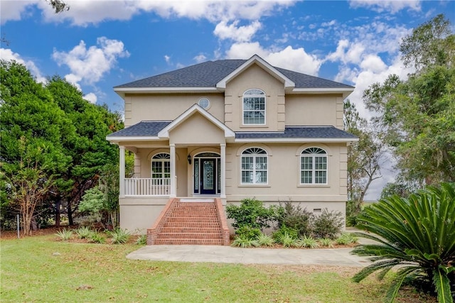 view of front of home featuring a front lawn and covered porch