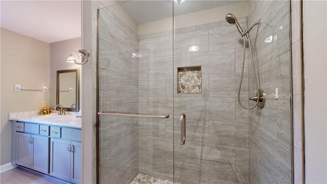 bathroom featuring vanity and walk in shower