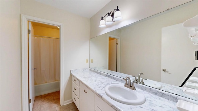 bathroom with vanity, tile patterned floors, and shower / bath combo with shower curtain