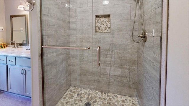 bathroom with vanity and an enclosed shower