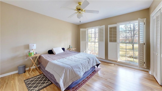 bedroom featuring ceiling fan and light wood-type flooring