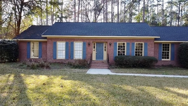 ranch-style house with a front lawn