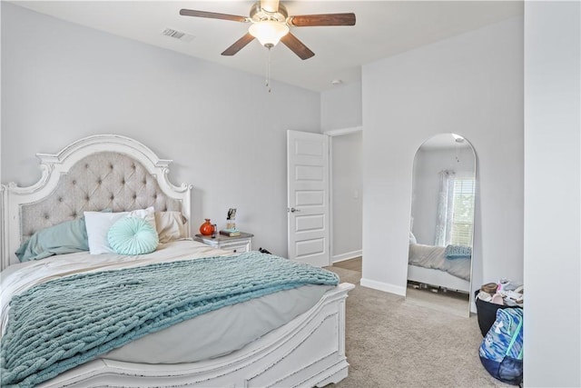 bedroom featuring ceiling fan and light colored carpet