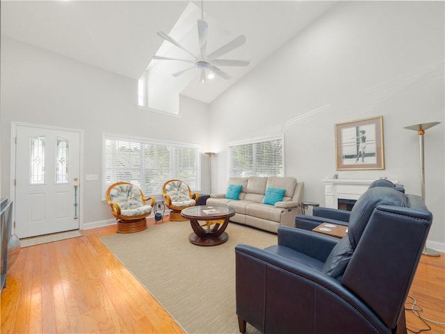 130 Peppertree Crossing Ave, Brunswick, GA 31525 - living area featuring high vaulted ceiling, a ceiling fan, light wood-style flooring, and baseboards
