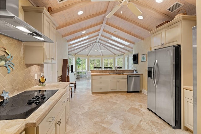 kitchen with wall chimney exhaust hood, a ceiling fan, appliances with stainless steel finishes, wood ceiling, and vaulted ceiling with beams