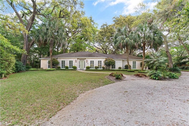ranch-style home with a front yard