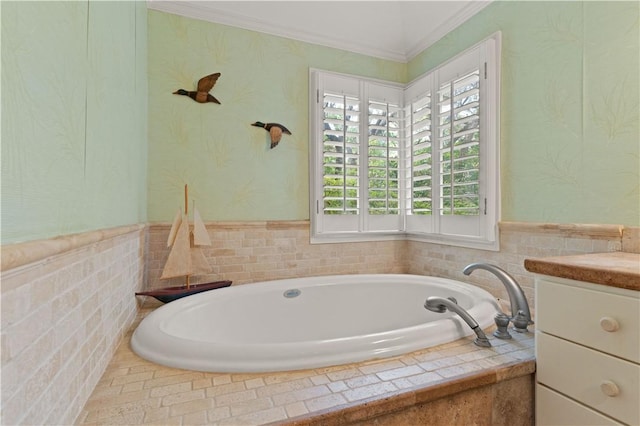 full bathroom with vanity, a bath, wallpapered walls, and crown molding