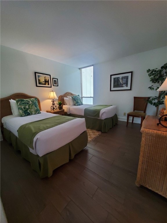 bedroom featuring dark hardwood / wood-style flooring