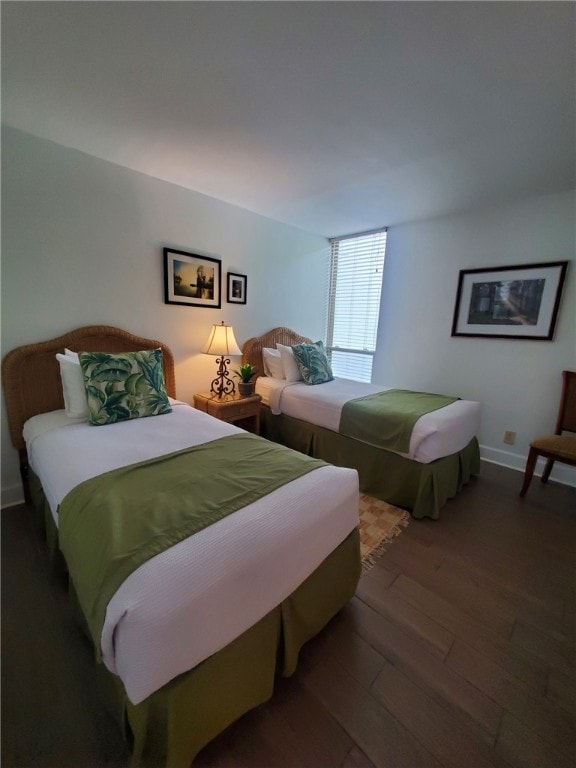 bedroom featuring dark hardwood / wood-style flooring