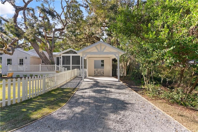 view of front of home featuring a sunroom