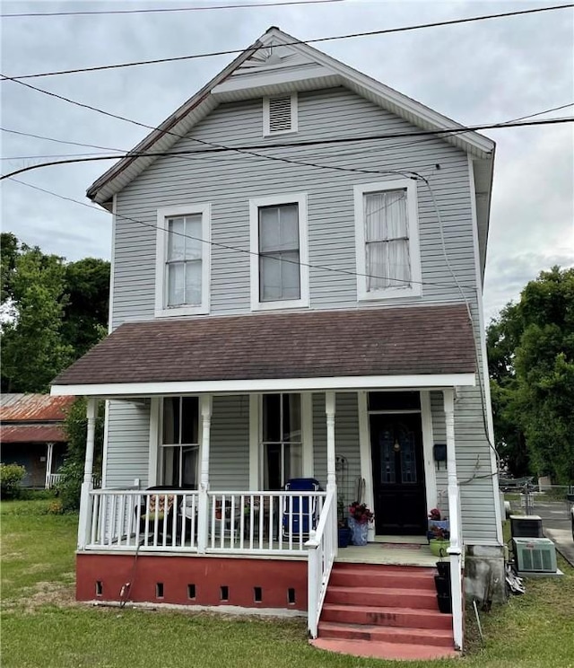 725 Grant St, Brunswick, GA 31520 - view of front of home with a front yard, roof with shingles, a porch, and crawl space