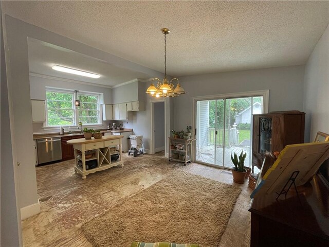 725 Grant St, Brunswick, GA 31520 - dining room featuring a textured ceiling, baseboards, and an inviting chandelier
