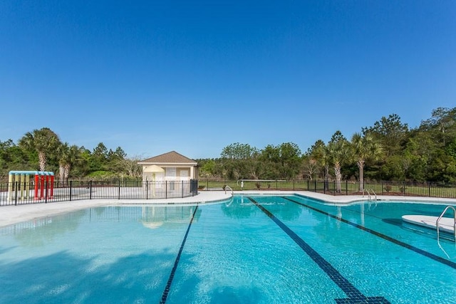43 Coral Cv, Brunswick, GA 31523 - community pool featuring fence and view of scattered trees