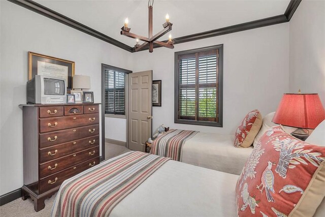 113 Cabretta Island Cir, Brunswick, GA 31520 - bedroom featuring carpet flooring, crown molding, a notable chandelier, and baseboards