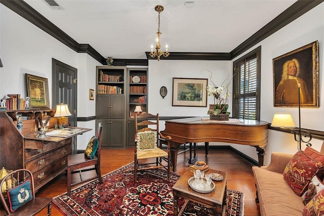 113 Cabretta Island Cir, Brunswick, GA 31520 - office space with visible vents, crown molding, baseboards, an inviting chandelier, and wood finished floors