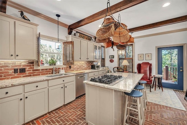 113 Cabretta Island Cir, Brunswick, GA 31520 - kitchen with decorative backsplash, stainless steel appliances, brick floor, and a sink