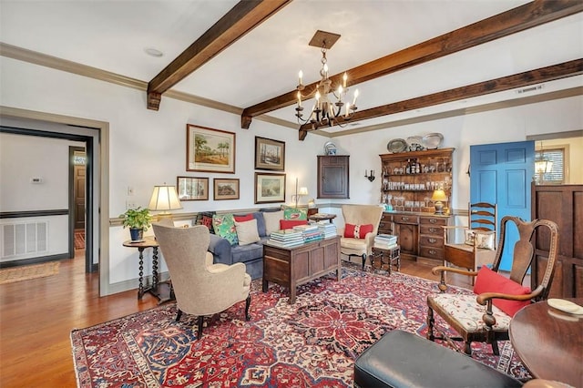 113 Cabretta Island Cir, Brunswick, GA 31520 - living room with an inviting chandelier, beamed ceiling, wood finished floors, and visible vents