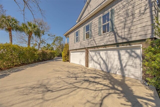113 Cabretta Island Cir, Brunswick, GA 31520 - view of side of home with concrete driveway and an attached garage