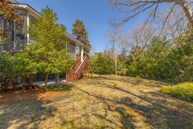 113 Cabretta Island Cir, Brunswick, GA 31520 - view of yard with a patio area, stairs, and a sunroom