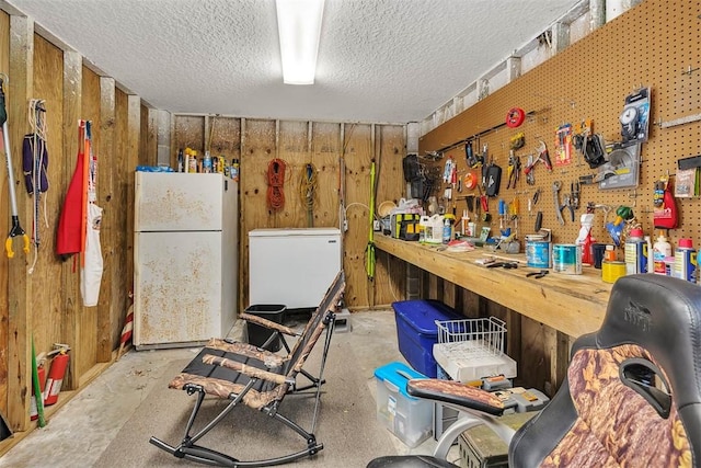113 Cabretta Island Cir, Brunswick, GA 31520 - interior space featuring a workshop area, wooden walls, and a textured ceiling