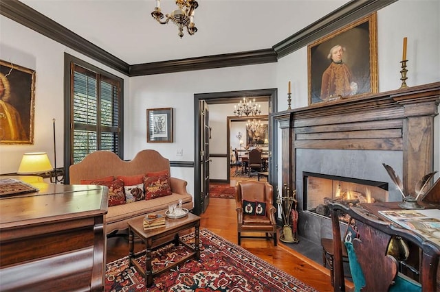113 Cabretta Island Cir, Brunswick, GA 31520 - living area featuring a notable chandelier, a fireplace, crown molding, and wood finished floors
