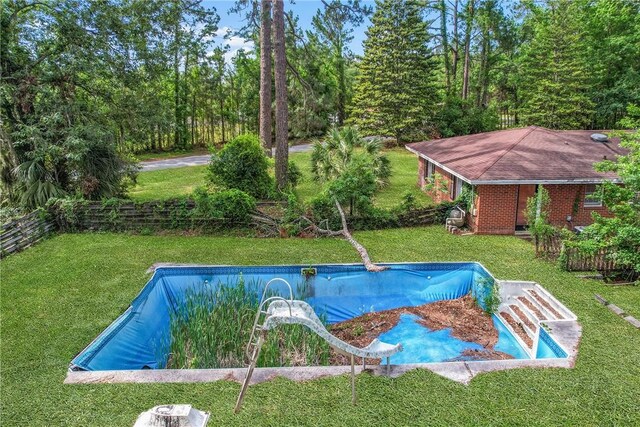 156 Lansing St, Brunswick, GA 31525 - view of swimming pool with a water slide and a yard