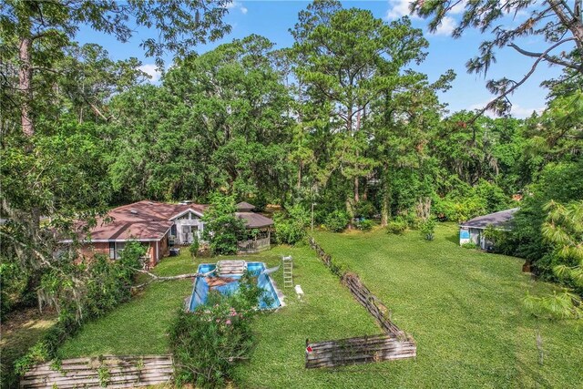 156 Lansing St, Brunswick, GA 31525 - view of green lawn with a wooded view