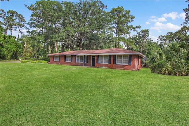 156 Lansing St, Brunswick, GA 31525 - ranch-style house with a front lawn and brick siding