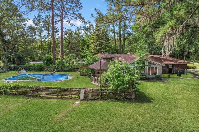 156 Lansing St, Brunswick, GA 31525 - view of grassy yard with an outdoor pool