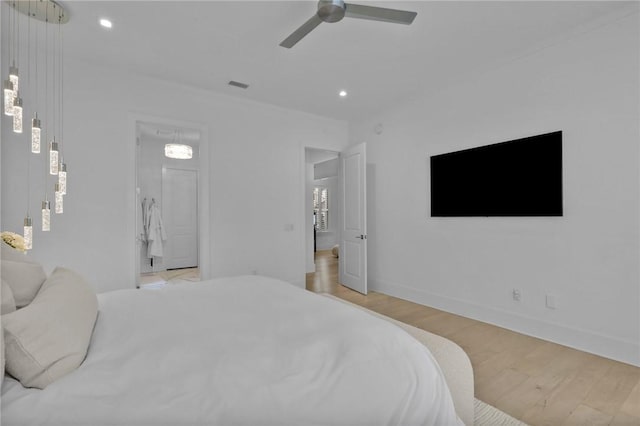 bedroom with ceiling fan and light hardwood / wood-style floors