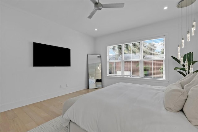 bedroom featuring ceiling fan and light hardwood / wood-style flooring