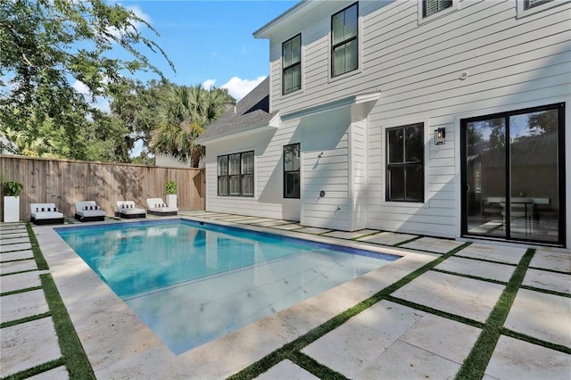 view of swimming pool featuring a patio area