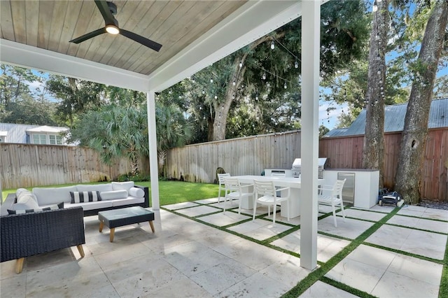 view of patio / terrace featuring ceiling fan, exterior kitchen, and an outdoor hangout area