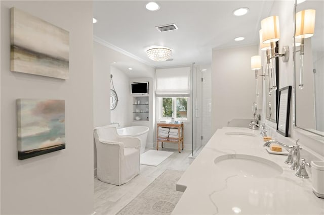 full bathroom featuring visible vents, ornamental molding, a sink, a shower stall, and a soaking tub