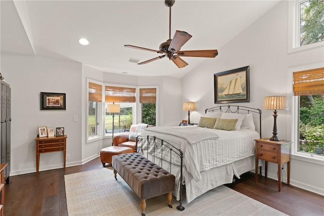 bedroom with wood finished floors, visible vents, baseboards, recessed lighting, and vaulted ceiling