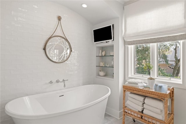 full bathroom featuring recessed lighting and a freestanding bath