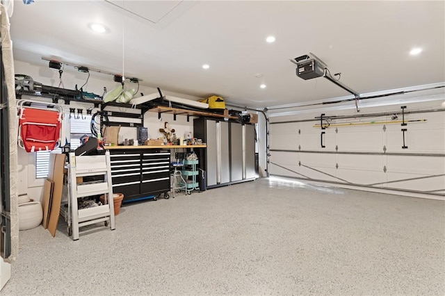 garage featuring recessed lighting and a garage door opener