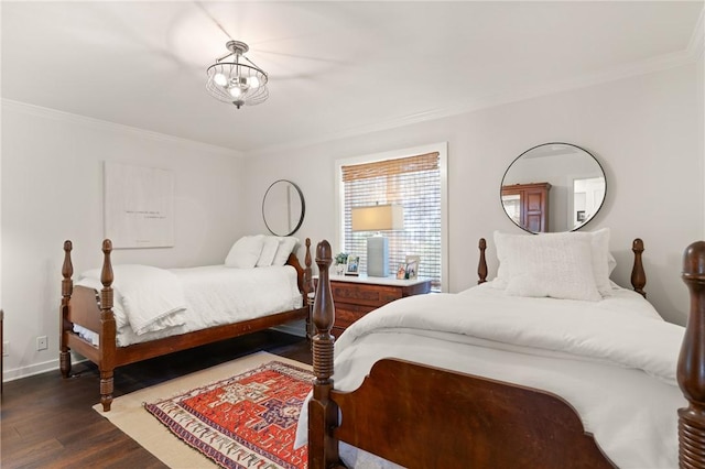 bedroom featuring baseboards, dark wood-type flooring, and ornamental molding